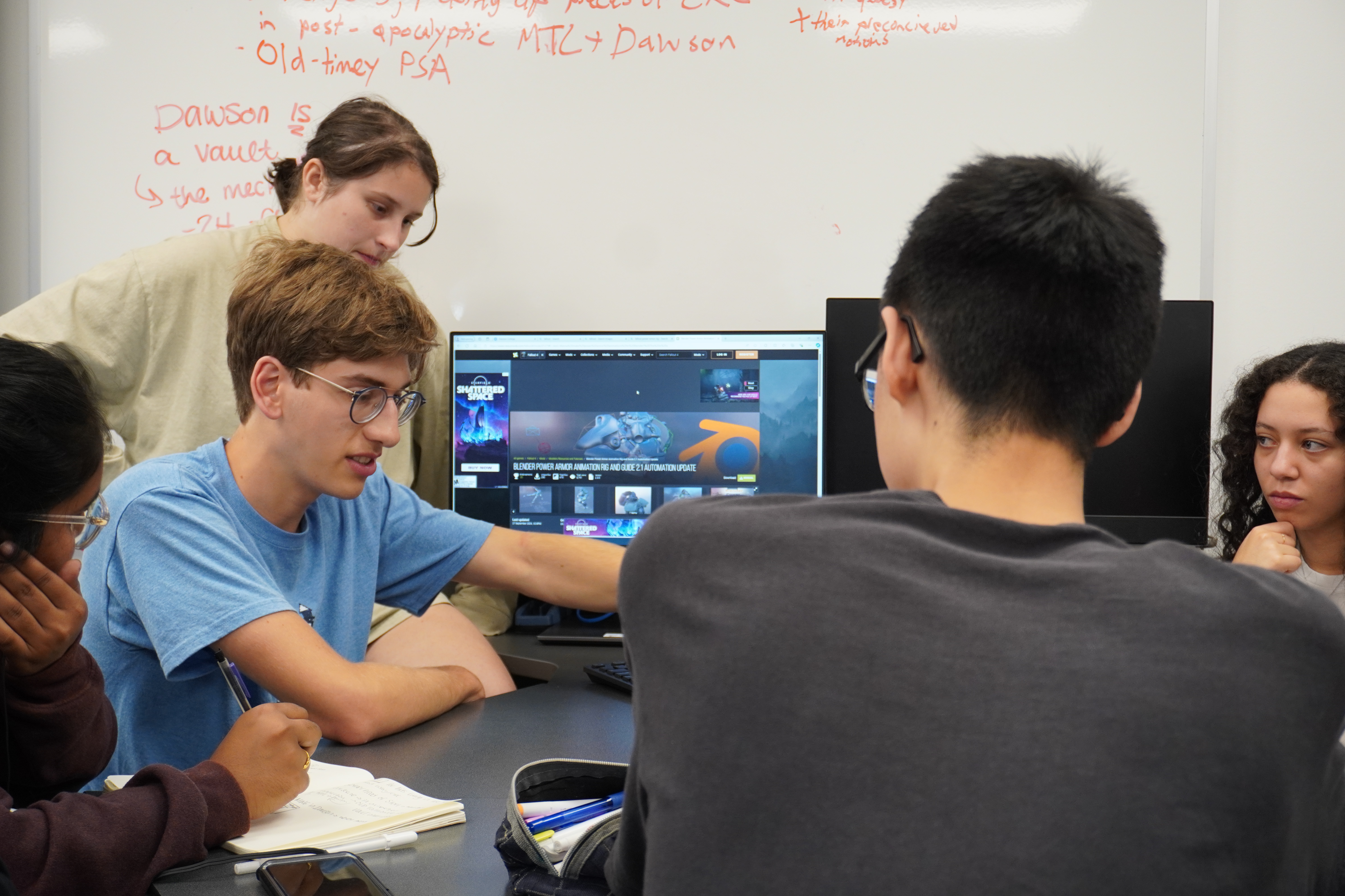 Students collaborating on robotics project, demonstrating hands-on learning approach with mentorship and peer support