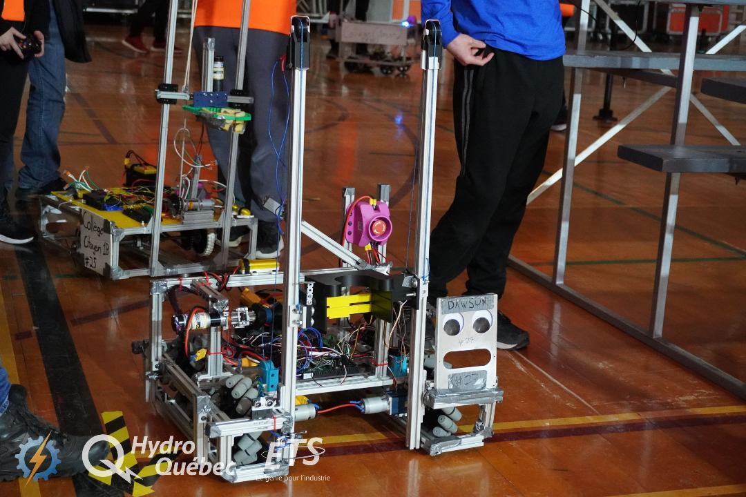Competition robot with mecanum wheels and claw mechanism on competition field